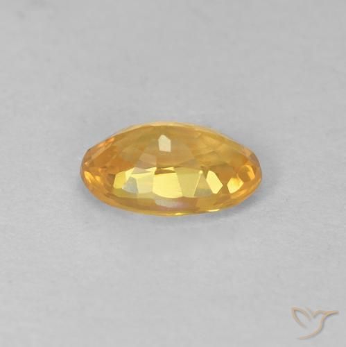 Zafiro Naranja dorado intenso natural de 0.57 ct, Ovalada, VS
