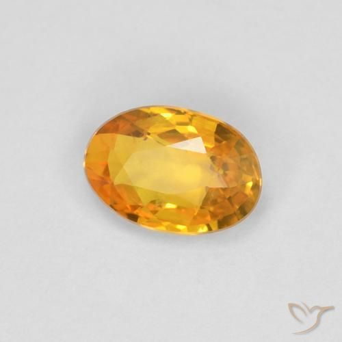 Zafiro Dorado naranja natural de 0.55 ct, Ovalada, VVS
