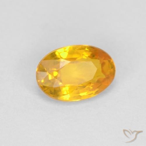 Zafiro Dorado naranja natural de 0.67 ct, Ovalada, VVS