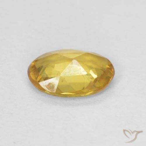 Zafiro Dorado medio natural de 0.61 ct, Ovalada, VVS-VS