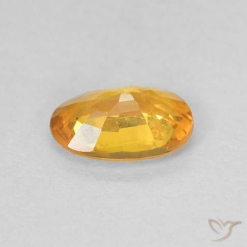 Zafiro Naranja dorado natural de 0.56 ct, Ovalada, VS