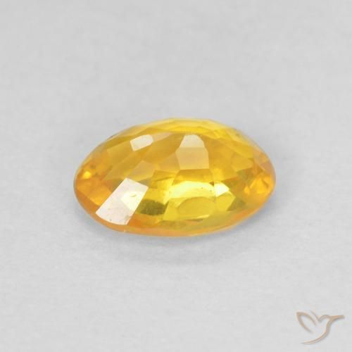 Zafiro Naranja medio natural de 0.61 ct, Ovalada, VS