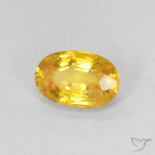 Zafiro Naranja dorado natural de 0.62 ct, Ovalada, VVS