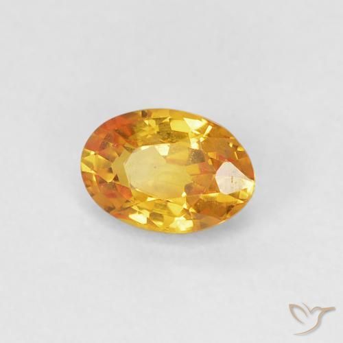 Zafiro Dorado naranja natural de 0.59 ct, Ovalada, VVS-VS