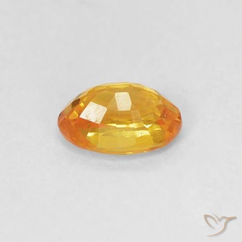 Zafiro Dorado naranja natural de 0.59 ct, Ovalada, VVS-VS