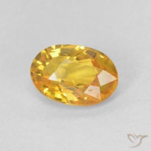 Zafiro Dorado naranja natural de 0.66 ct, Ovalada, VVS-VS