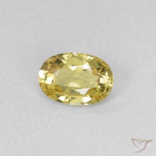 Zafiro Dorado claro natural de 0.54 ct, Ovalada, VVS