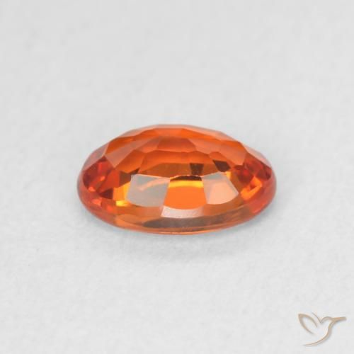Zafiro Naranja rojizo natural de 0.64 ct, Ovalada, VVS