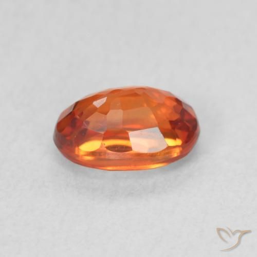 Zafiro Naranja rojizo natural de 0.78 ct, Ovalada, VVS