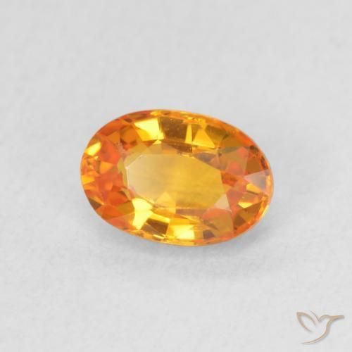 Zafiro Naranja claro natural de 0.64 ct, Ovalada, VVS