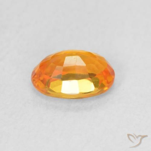 Zafiro Naranja claro natural de 0.64 ct, Ovalada, VVS