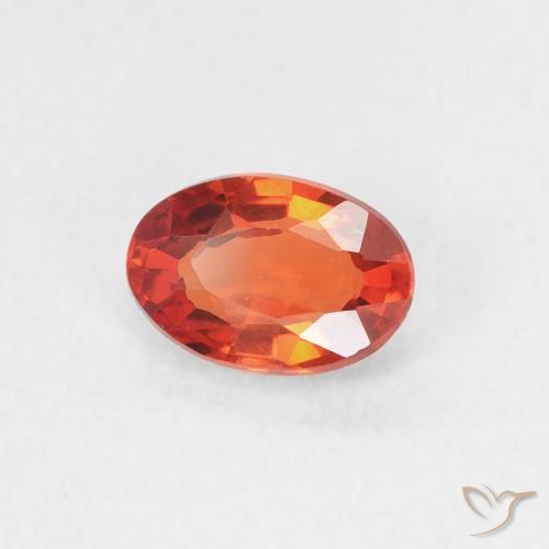 Zafiro Naranja rojizo natural de 0.64 ct, Ovalada, VVS