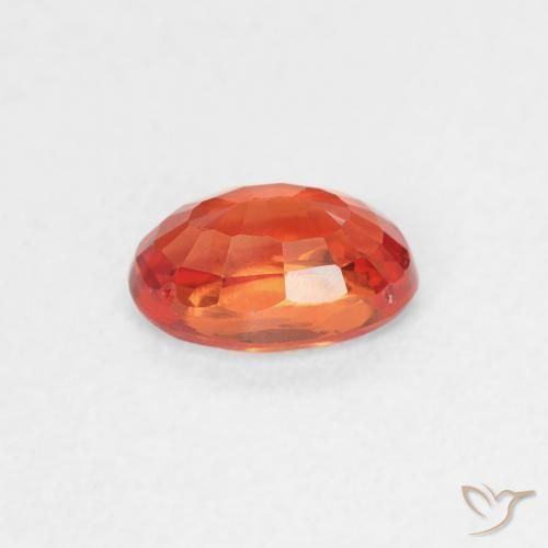 Zafiro Naranja rojizo natural de 0.64 ct, Ovalada, VVS