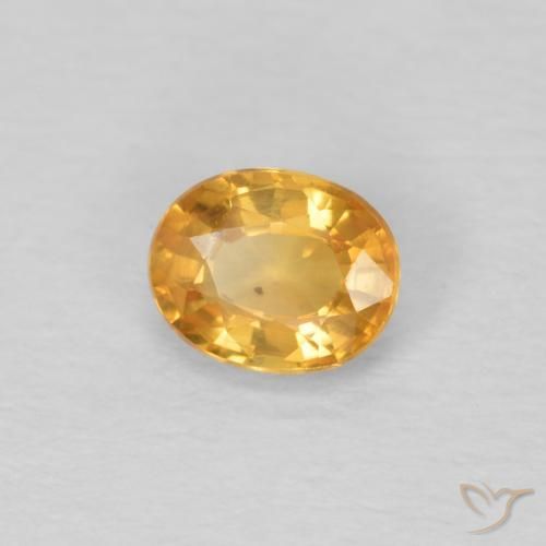 Zafiro Dorado naranja natural de 0.51 ct, Ovalada, VVS-VS