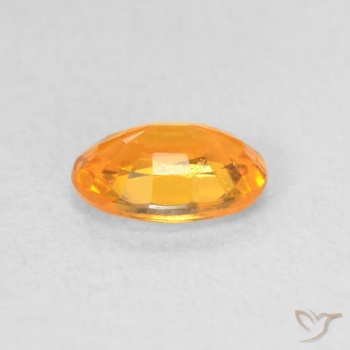 Zafiro Dorado naranja natural de 0.63 ct, Ovalada, VS