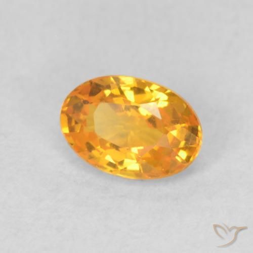 Zafiro Dorado naranja oscuro natural de 0.62 ct, Ovalada, VVS-VS