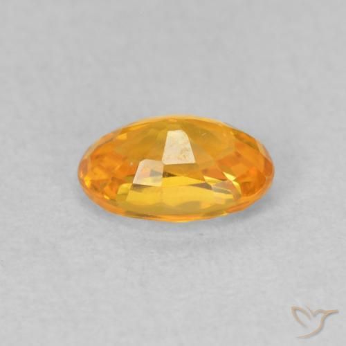 Zafiro Dorado naranja oscuro natural de 0.62 ct, Ovalada, VVS-VS