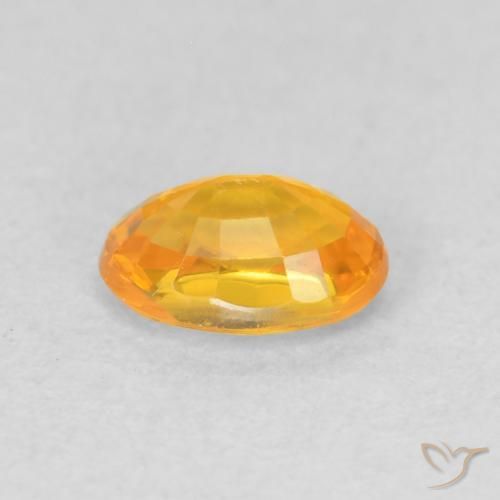 Zafiro Dorado naranja intenso natural de 0.68 ct, Ovalada, VVS-VS