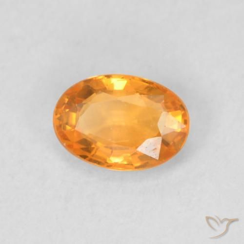 Zafiro Dorado naranja natural de 0.57 ct, Ovalada, VVS-VS