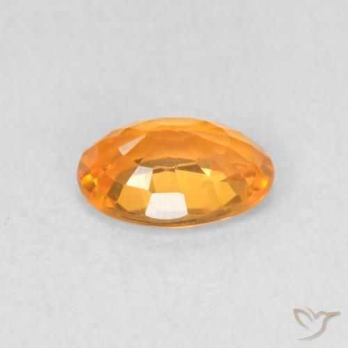 Zafiro Dorado naranja natural de 0.57 ct, Ovalada, VVS-VS