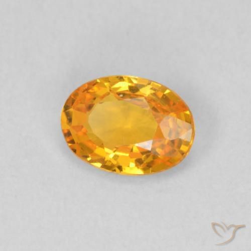Zafiro Naranja claro natural de 0.52 ct, Ovalada, VS
