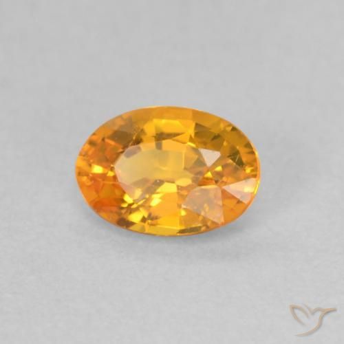 Zafiro Naranja albaricoque natural de 0.59 ct, Ovalada, VS