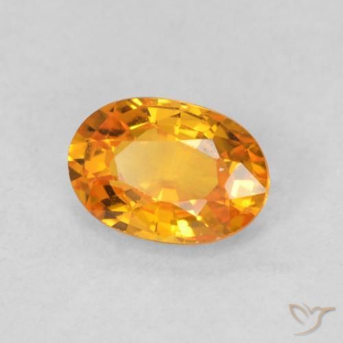 Zafiro Naranja claro natural de 0.68 ct, Ovalada, VS