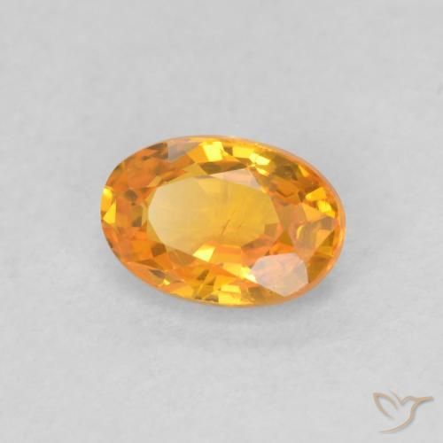 Zafiro Naranja claro natural de 0.61 ct, Ovalada, VS