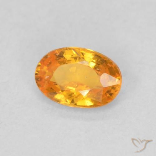 Zafiro Naranja claro natural de 0.54 ct, Ovalada, VS