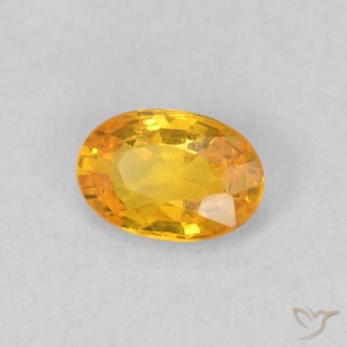 Zafiro Naranja claro natural de 0.59 ct, Ovalada, VS