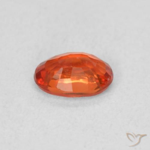 Zafiro Naranja cálido natural de 0.56 ct, Ovalada, VS