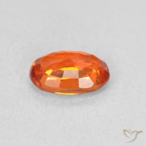 Zafiro Naranja medio natural de 0.64 ct, Ovalada, VS