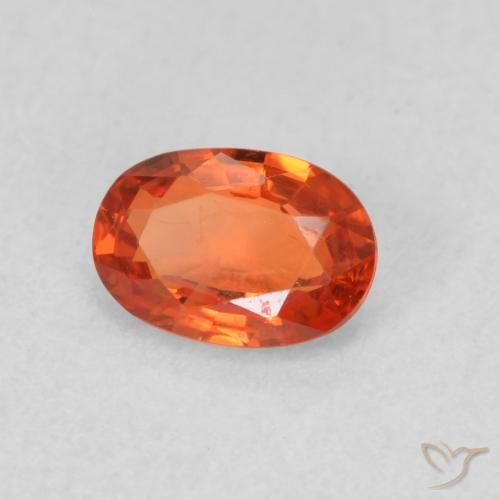 Zafiro Naranja rojizo natural de 0.66 ct, Ovalada, VS