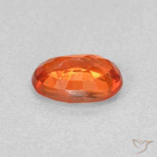 Zafiro Naranja rojizo natural de 0.66 ct, Ovalada, VS