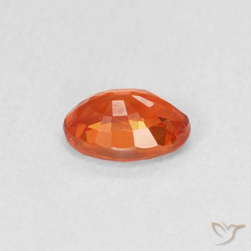 Zafiro Naranja rojizo natural de 0.69 ct, Ovalada, VS
