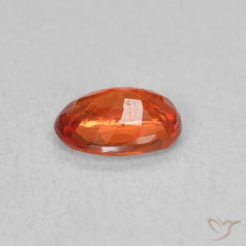 Zafiro Naranja rojizo natural de 0.57 ct, Ovalada, VS