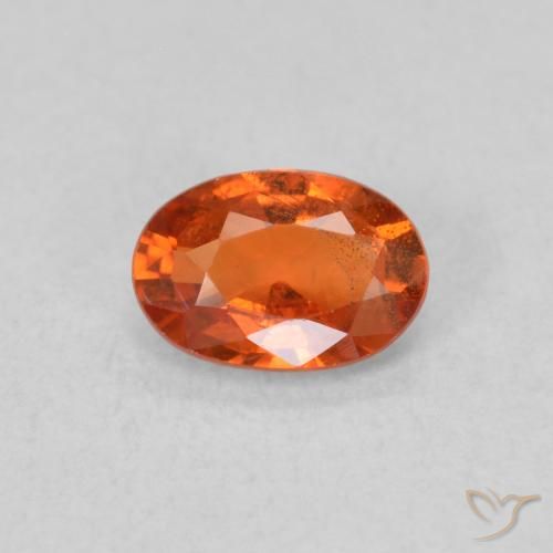 Zafiro Naranja rojizo natural de 0.65 ct, Ovalada, VS