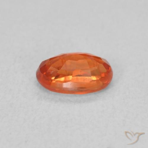 Zafiro Naranja rojizo natural de 0.71 ct, Ovalada, VS