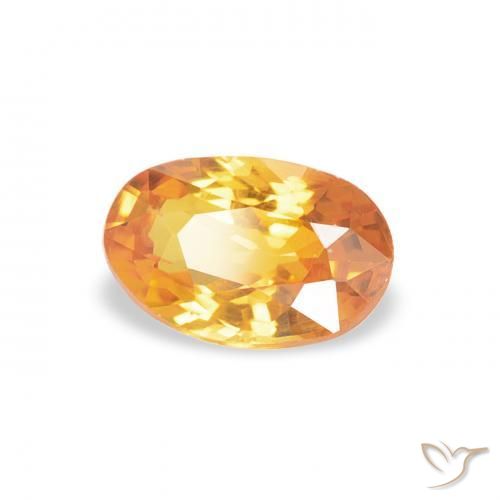 Zafiro Dorado naranja intenso natural de 0.60 ct, Ovalada, VS