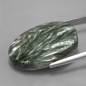 Serafinita verde natural de 24,96 ct, corte óvalo, opaco