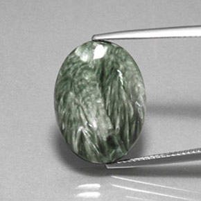 Serafinita verde natural de 10,82 ct, corte óvalo, opaco