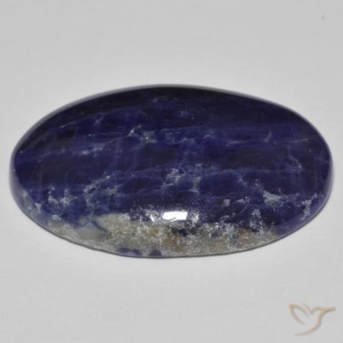 Sodalita Azul negruzco natural de 28.42 ct, Ovalada, Opaco