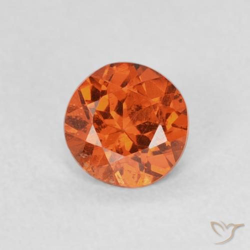 0.57ct Natural Ámbar naranja Hilo de espesartita, Redondo, SI