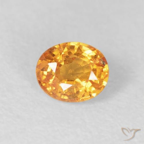 0.57ct Natural Dorado naranja Hilo de espesartita, Ovalada, VS