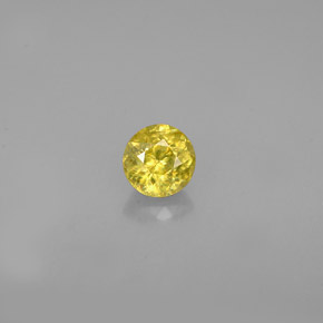 Esfena Dorado verdoso natural de 0.39 ct, Corte Redondo, VS