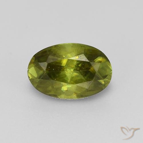 0.57ct Natural Verde terroso cálido esfena, Ovalada, VS
