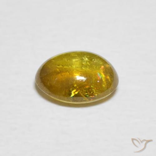 esfena Amarillo amarronado natural de 1.02 ct, Ovalada, Transparente