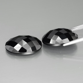 Gemas de Espinela Negro natural de 26.23 ct, Corte Óvalo, Opaco