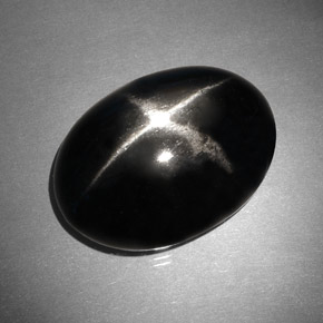 Diopsido estrella negro natural de 37,46 ct, corte óvalo, opaco