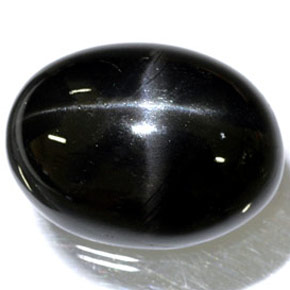Diopsido estrella negro natural de 24,45 ct, corte óvalo, opaco